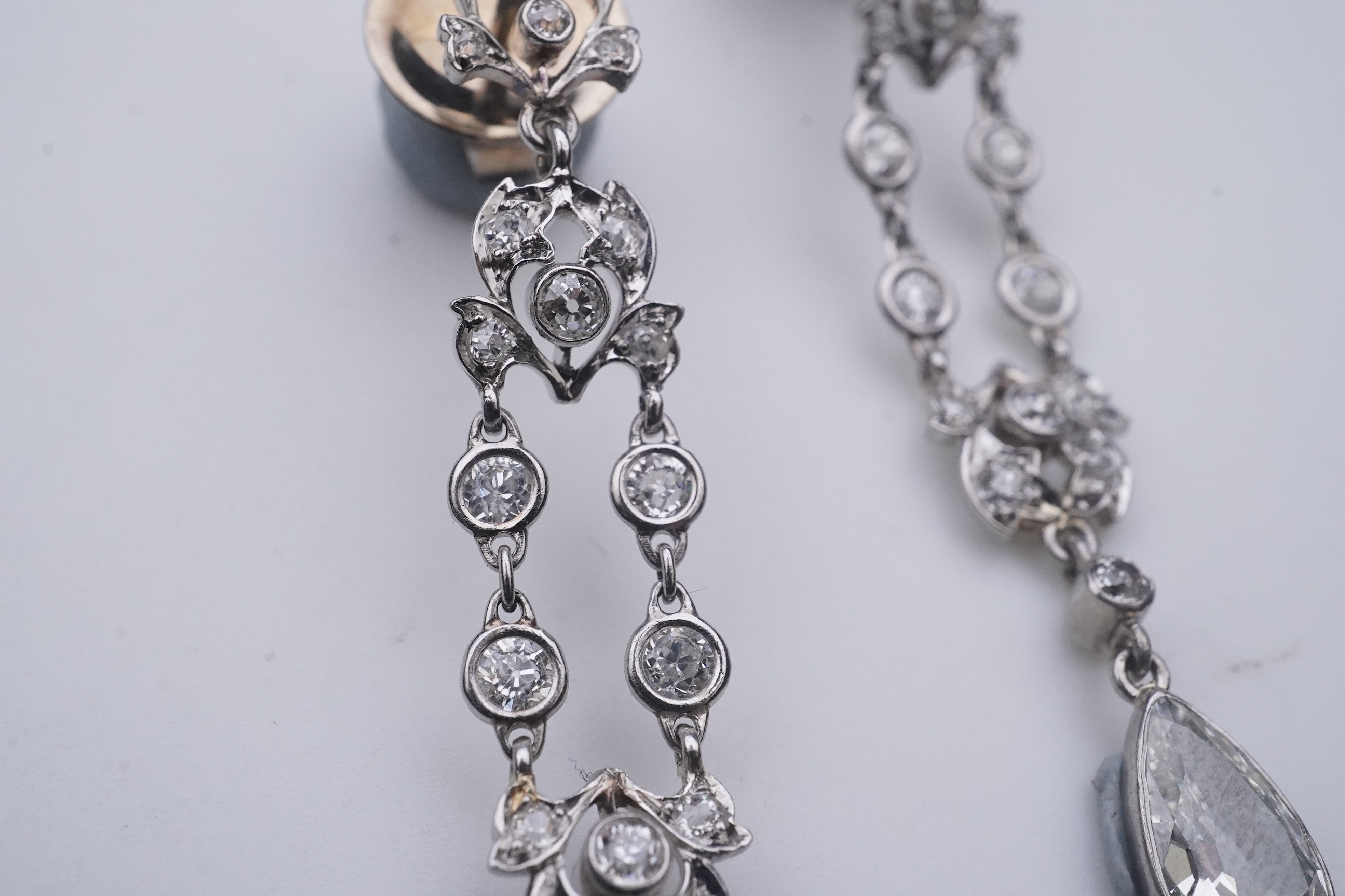 A pair of diamond earrings, early 20th century composite